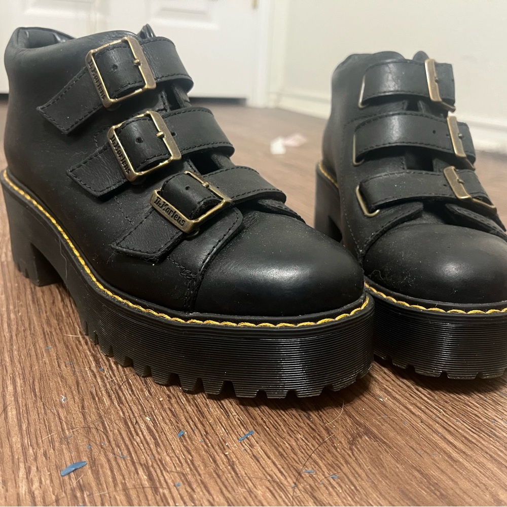Unisex 8.5 black Coppola Doc Marten boots with adjustable buckles.